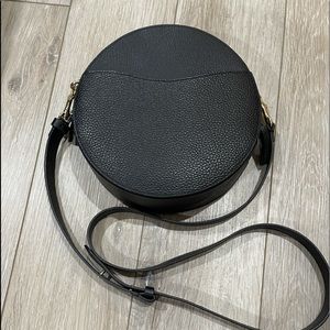 Cuyana black leather round bag.Great condition. Can be worn as crossbody.Used 3x